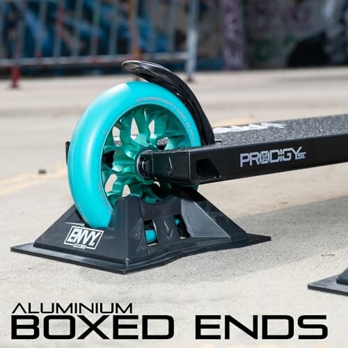 Aluminium boxed ends on a scooter with turquoise wheel.