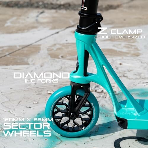 Close-up of turquoise scooter front wheel with specifications.